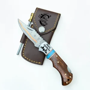 Personalized handmade Copper Damascus steel folding pocket knife with walnut wood and turquoise handle, custom engraved, leather sheath, and fire starter.